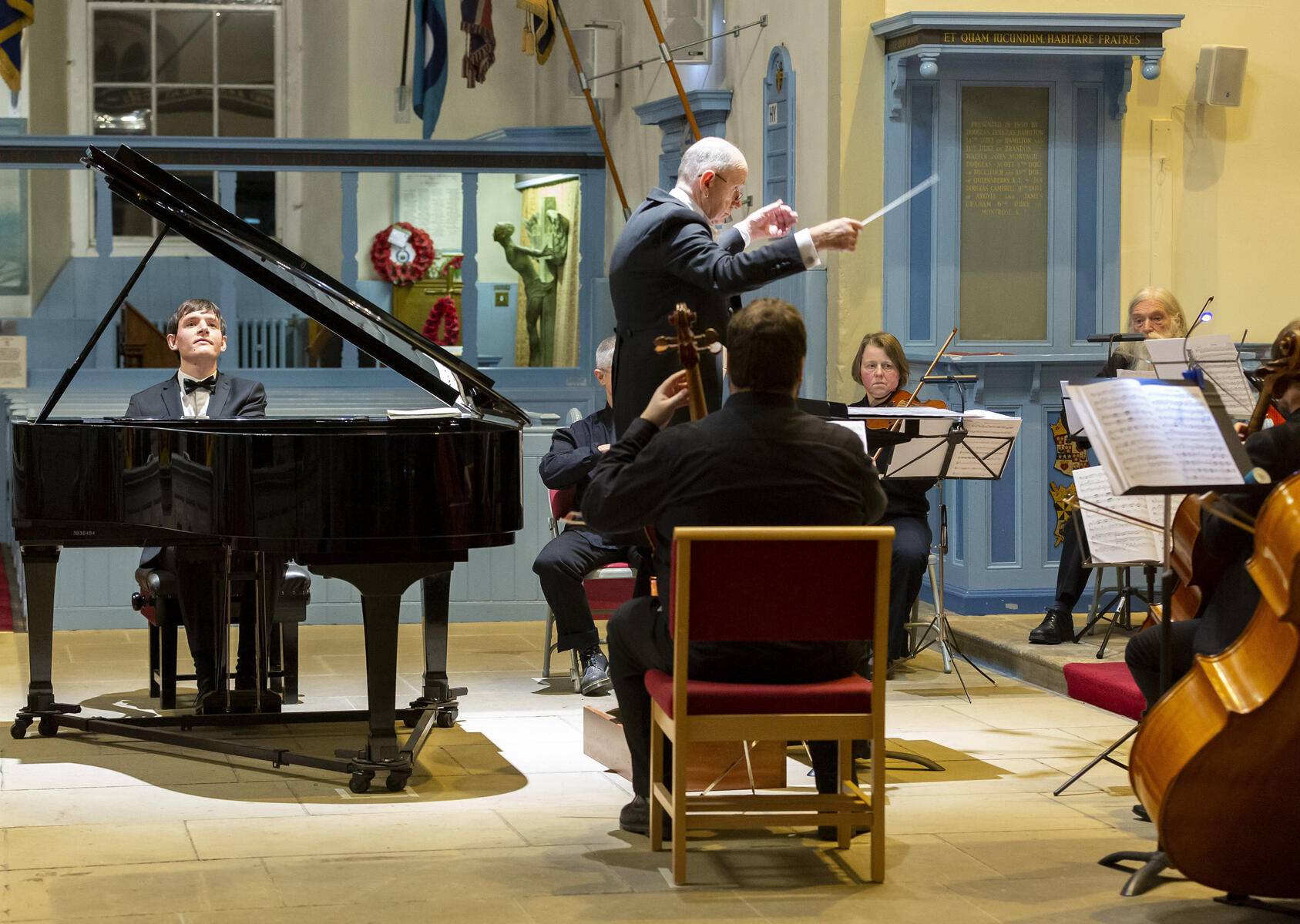 Matthew Shiel plays a piano concerto with the Abbotsford String Orchestra directed by Derek Williams at Canongate Kirk, Edinburgh